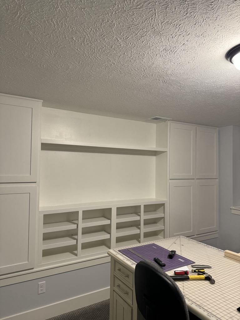 Side view of craft room built-in cabinetry and work surface