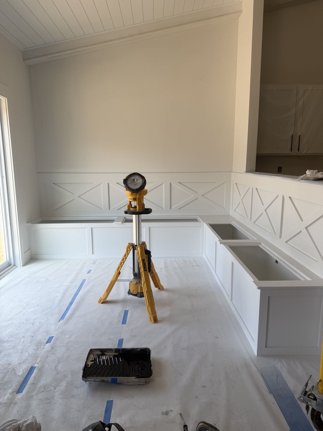 Before: Built-in banquette in progress with work light and floor protection