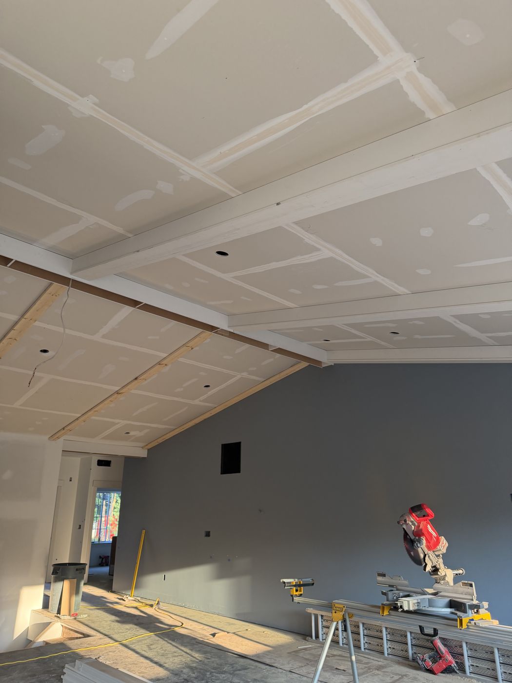 Ceiling with layout strips and blocking before beams are installed