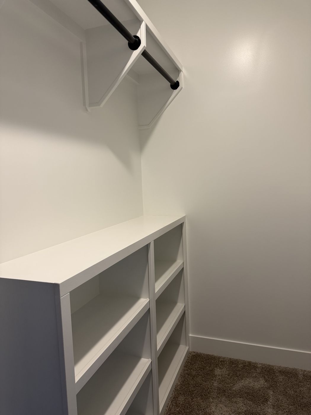 White closet shelving and hanging rod