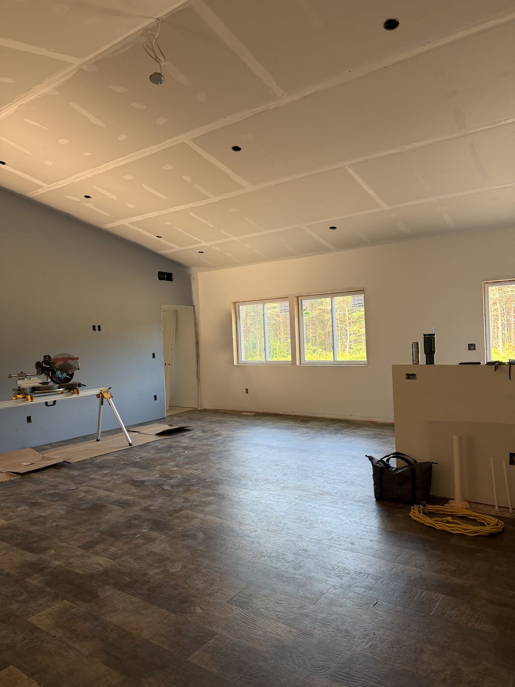 Great room after drywall with ceiling ready for finish work