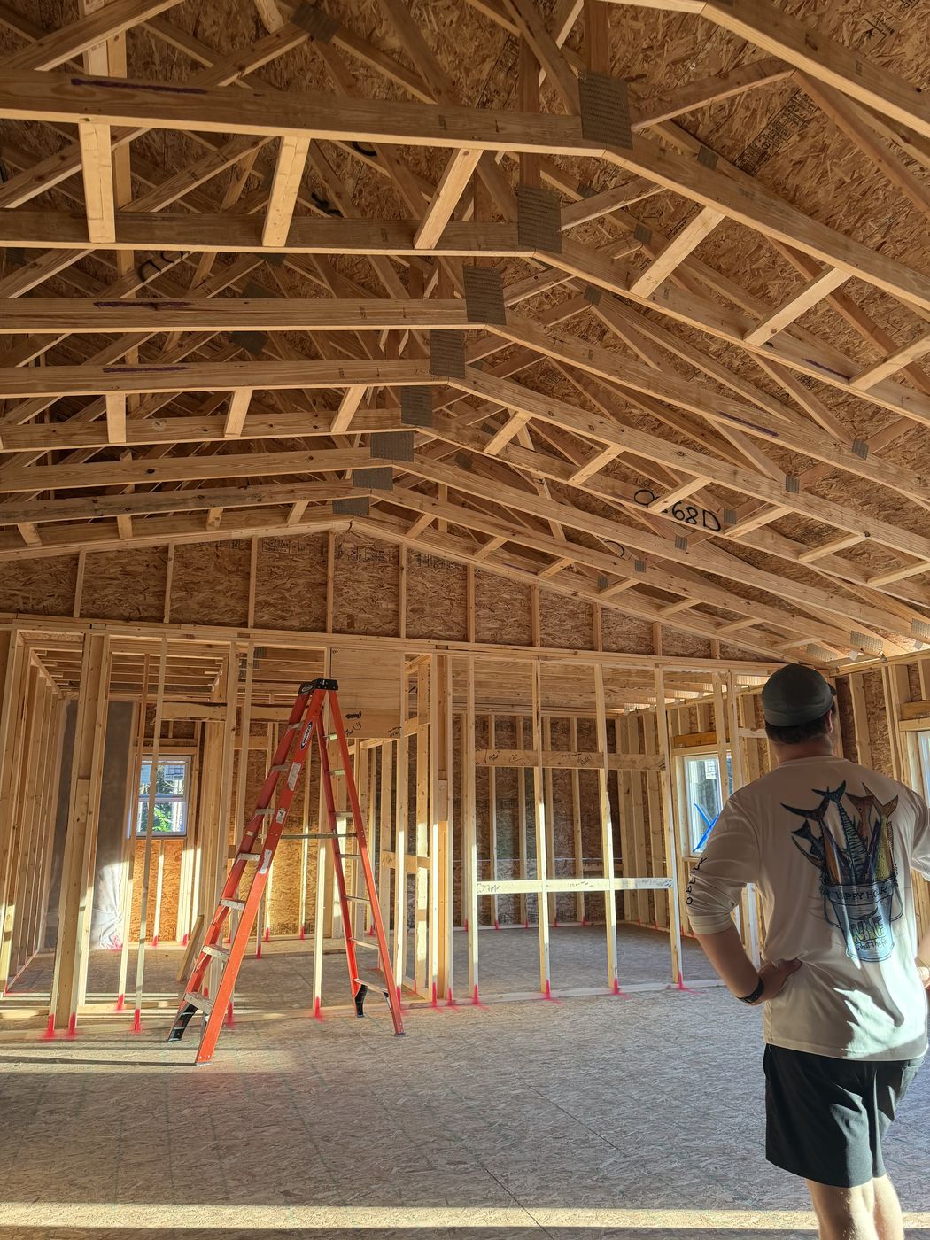 Great room with open trusses and framed walls