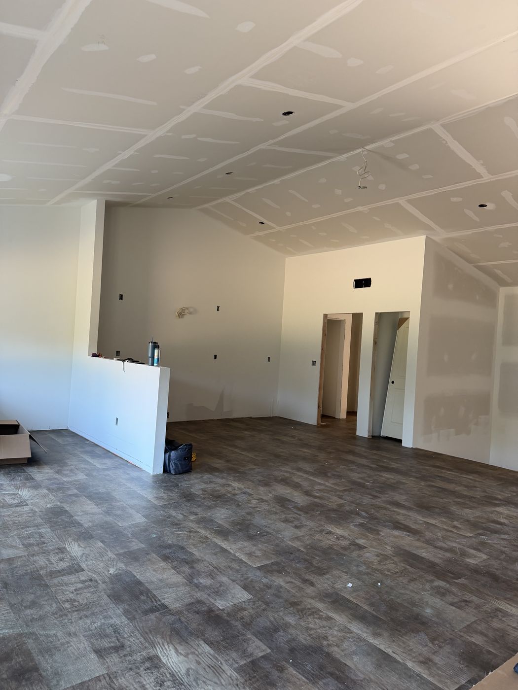 Kitchen area after drywall before cabinets and trim