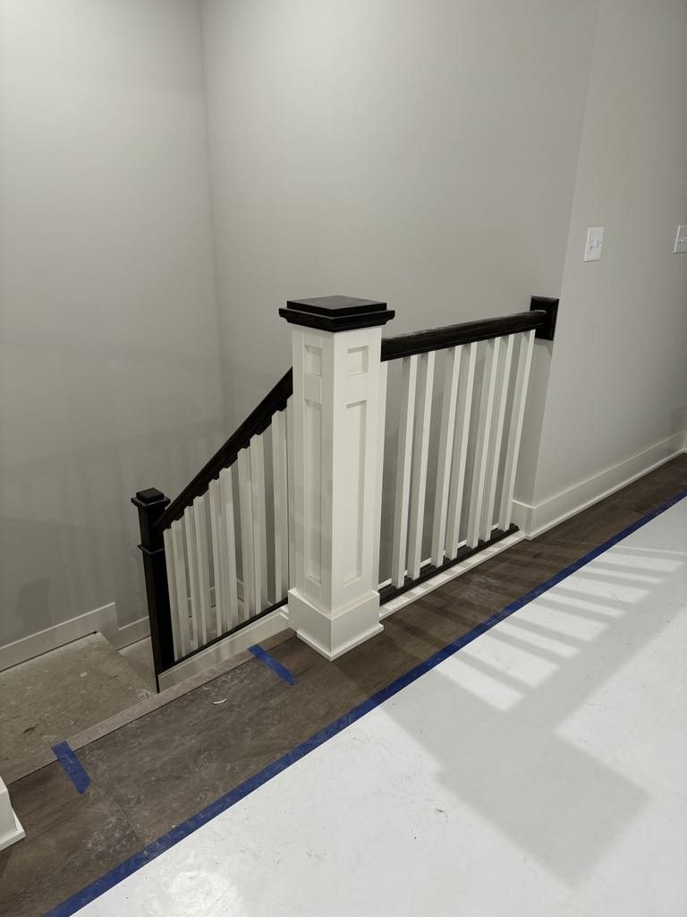 Interior stair rail and newel post finish carpentry